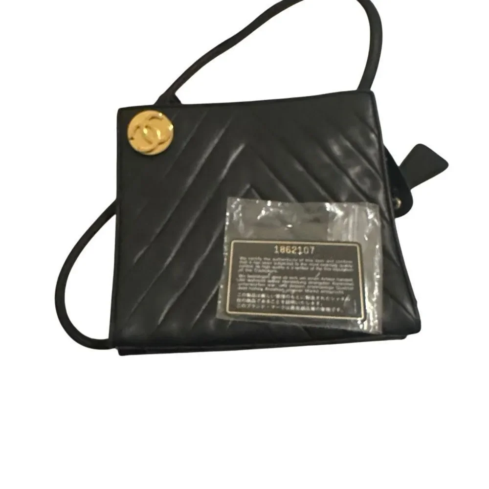 CHANEL Black Chevron Leather Shoulder Bag with Gold Accent